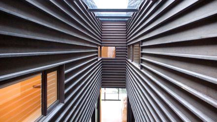 Courtyard House On A Steep Site